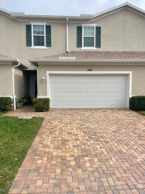 Beautiful 3 BEDROOM 2 AND 1 2 BATH TOWNHOME WITH IMPACT GLASS WINDOWS, FRESHLY PAINTED INSIDE with OPEN CONCEPT KITCHEN WITH WHITE CUSTOM 42'' Cabinets, STAINLESS APPLIANE PACKAGE WITH WASHER ...