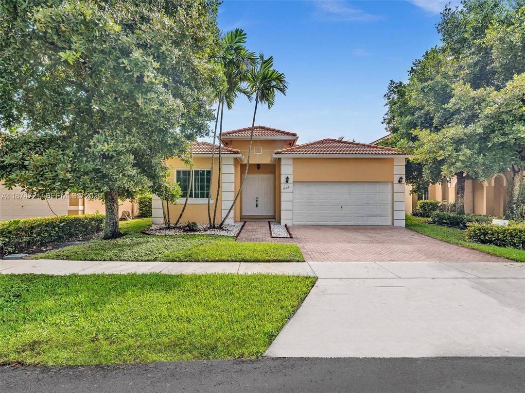 Lakefront living meets everyday comfort in this 4 bedroom, 3 bath pool home located inside the sought after gated community of Monarch Lakes in Miramar.