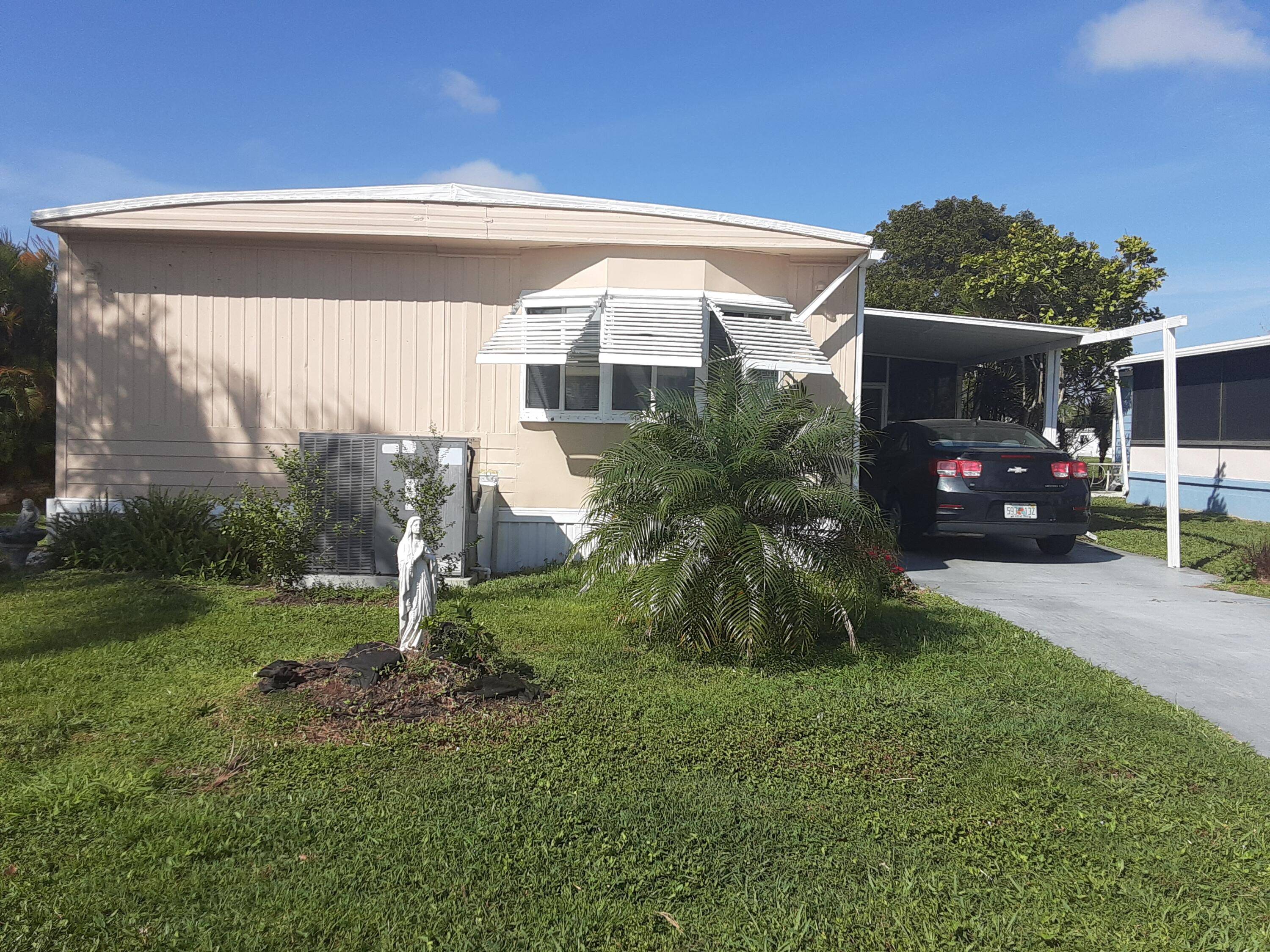 Nicely maintained home located on the canal in the much sought after Spanish Lakes Community.