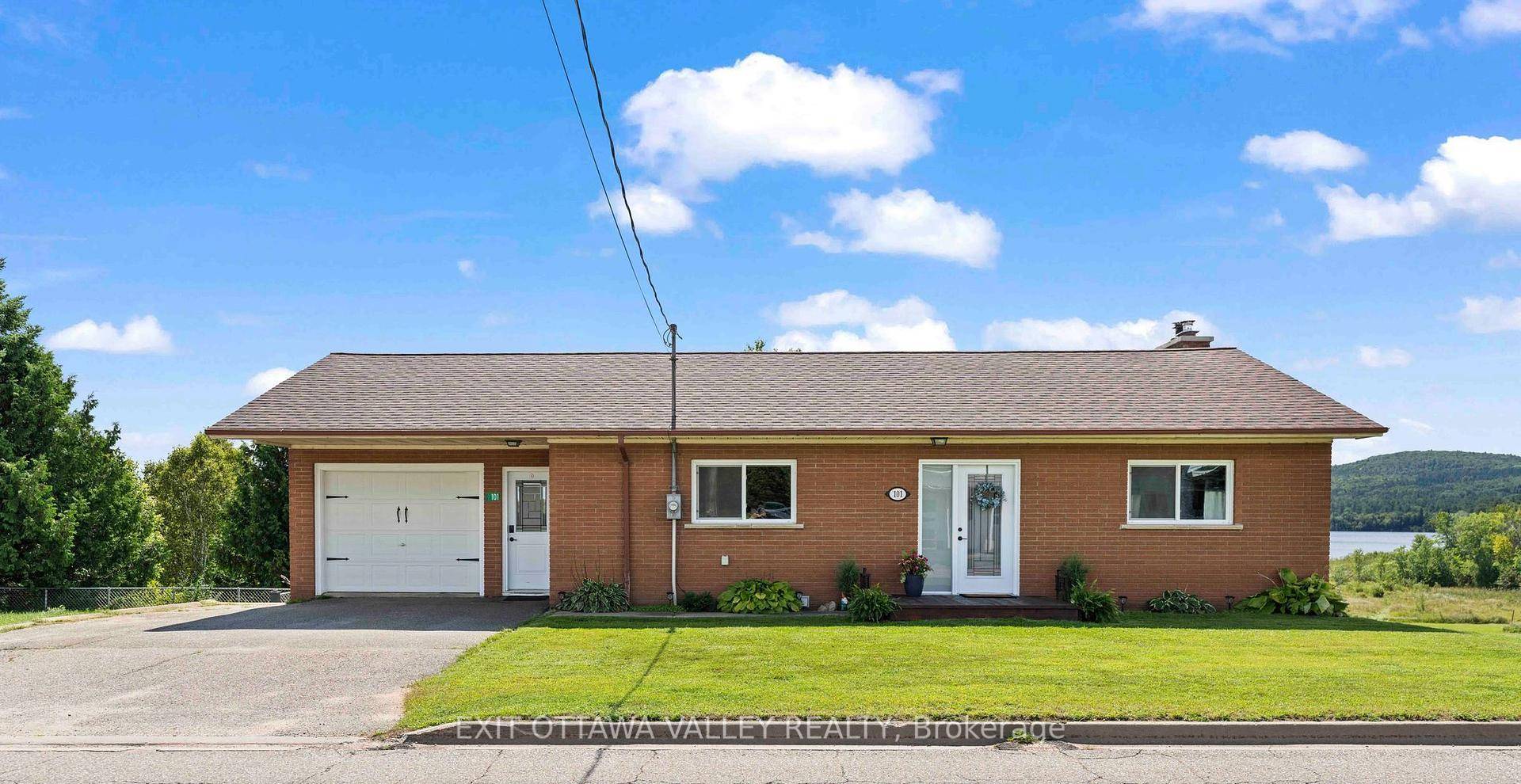 Discover the incredible potential of this solid brick bungalow, ideally situated on a full acre of prime waterfront along the scenic shores of Kamaniskeg Lake.