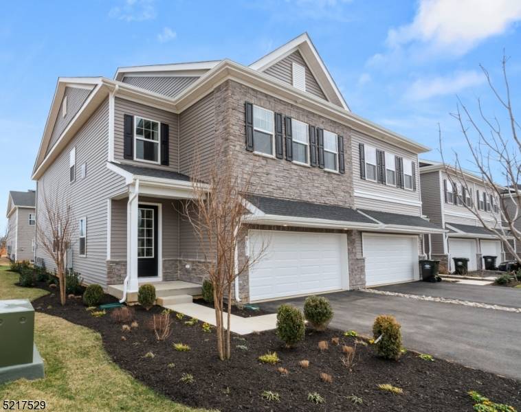 NEW CONSTRUCTION ! This attractive townhome offers modern style, generous space, and a prime location in desirable Morris County, featuring a two car garage and a versatile ground level bonus ...