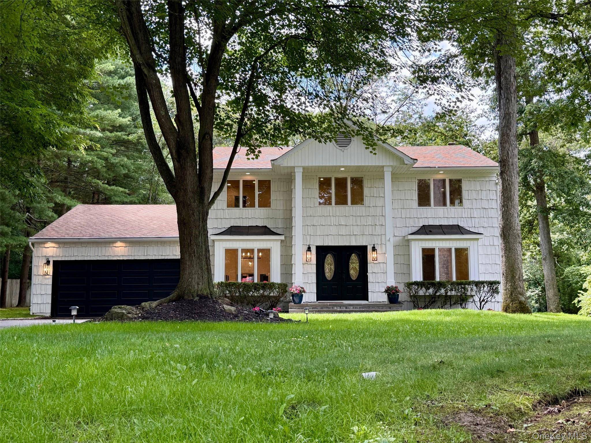 This newly renovated 5 bedroom Center Hall Colonial is situated on a private cul de sac within the highly regarded Half Hollow Hills School District.