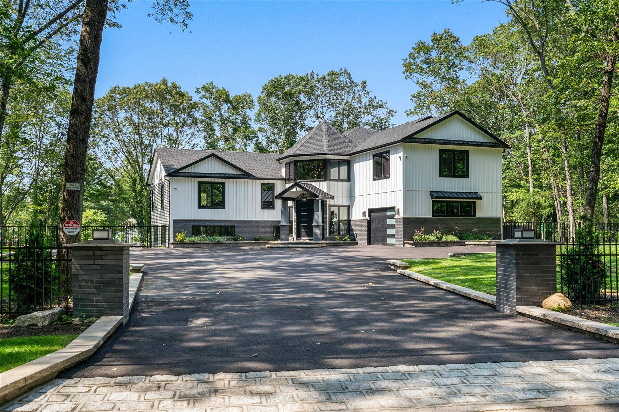 EAST NORWICH Towering with presence and crafted with intention, this architectural marvel rises from a private acre in East Norwich its signature V formation and dual peak rooflines evoking the ...