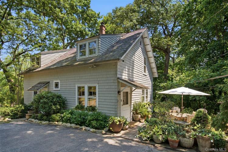 Wonderfully private and beautifully updated, this unfurnished and charming 4 bedroom cottage is nestled in a serene, secluded setting with picturesque partial water views.