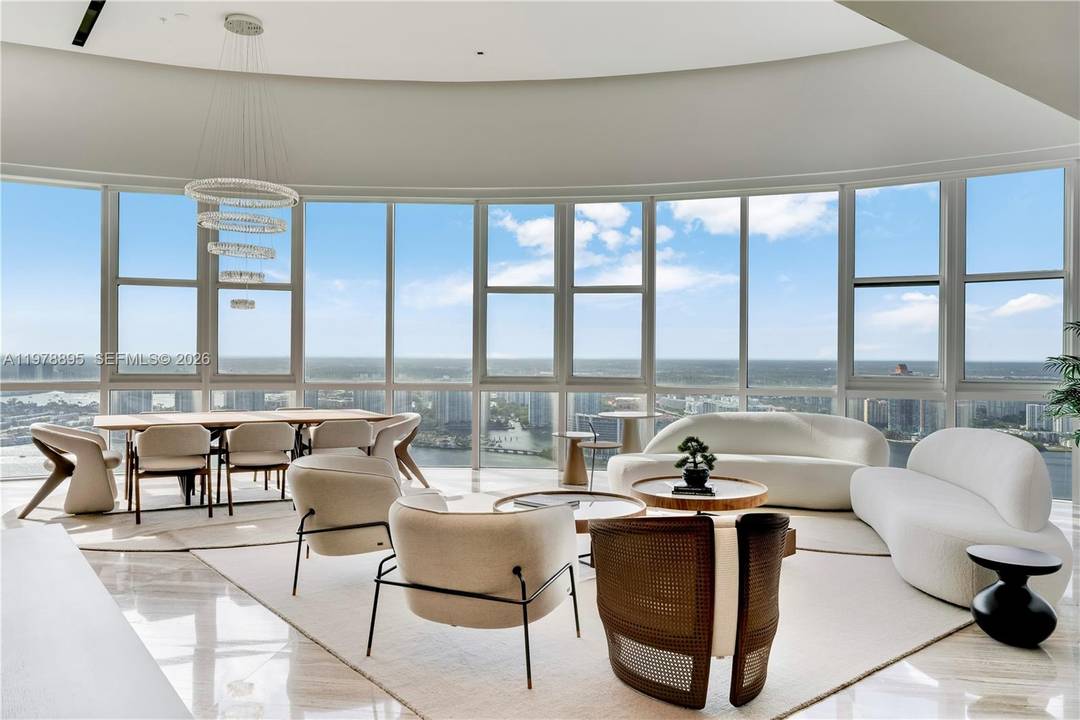 Perched on the 55th floor of the prestigious Trump Royale, this extraordinary two story penthouse is a true sky mansion offering breathtaking panoramic views of the Atlantic Ocean, Intracoastal Waterway ...
