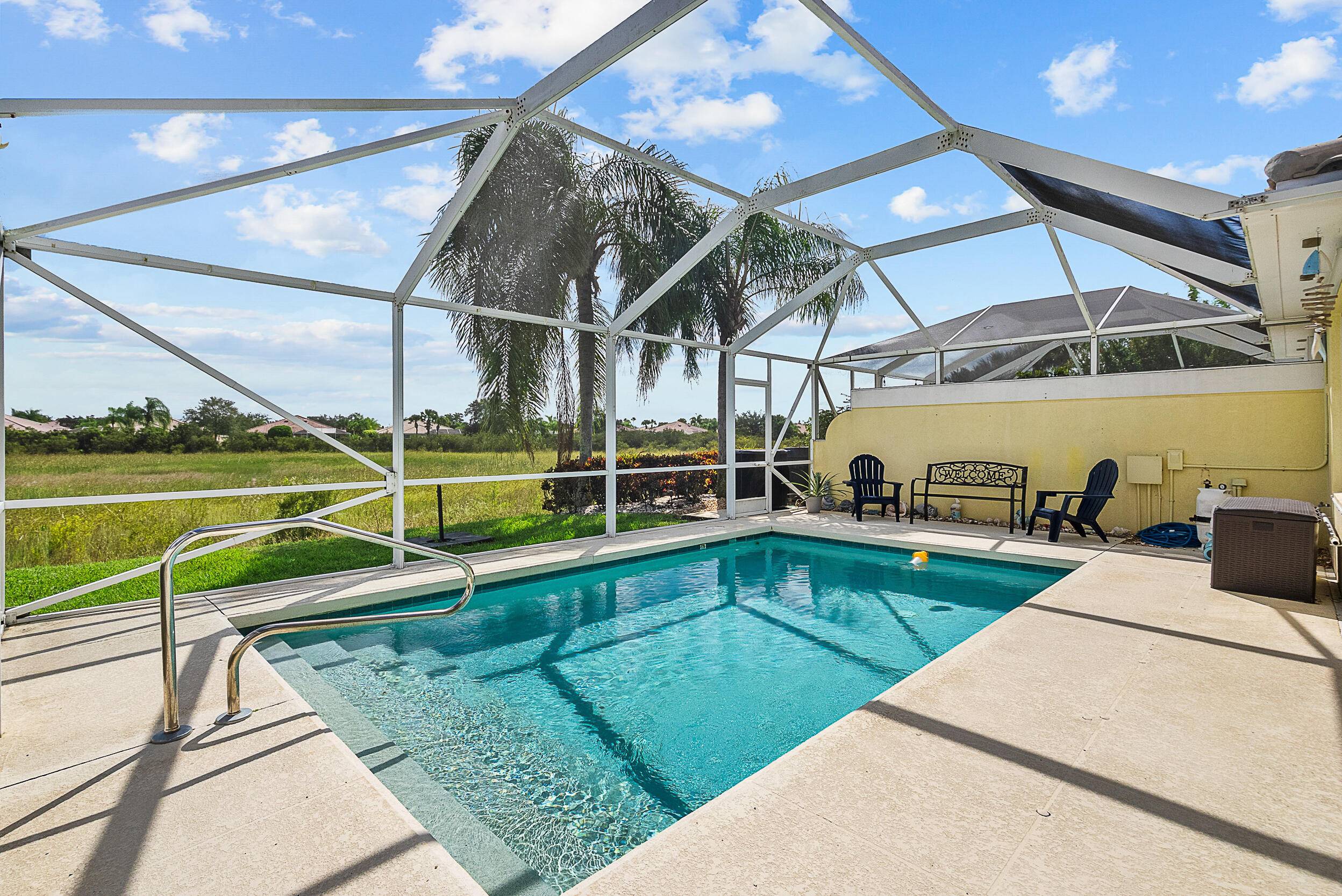 Immaculate villa with a heated, screened in pool preserve view.
