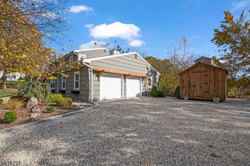 Backing to serene private woodlands, this timeless 5 bedroom, 3 bath Colonial is beautifully sited on 1.