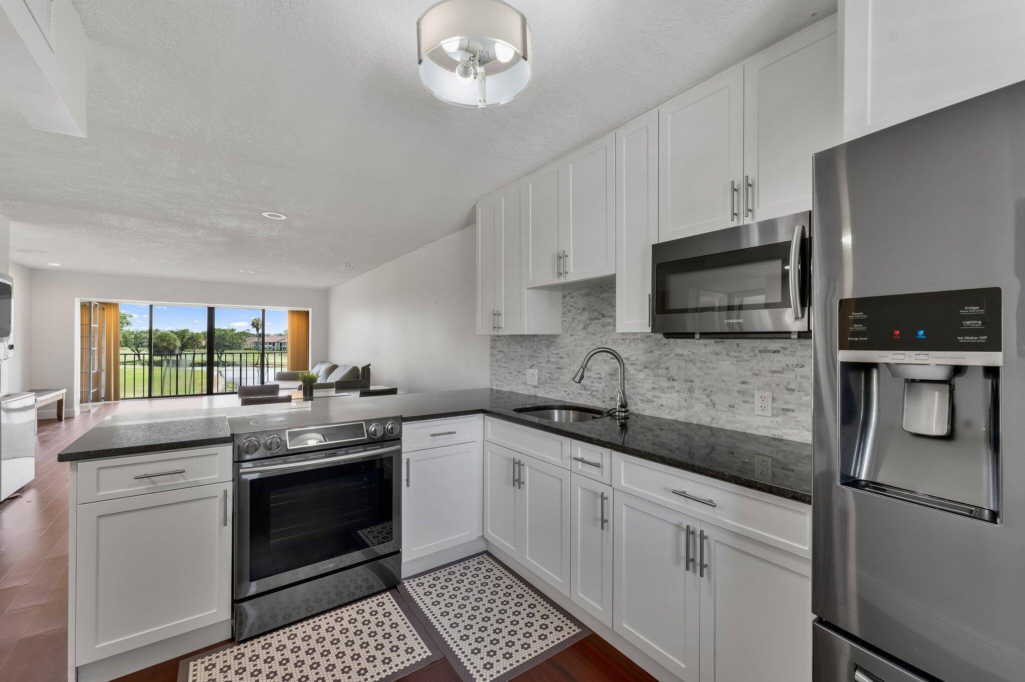 Wake up to tranquil lake and golf course views in this thoughtfully remodeled 2 bedroom, 2 bath condo, located in an all ages community of The Fountains.