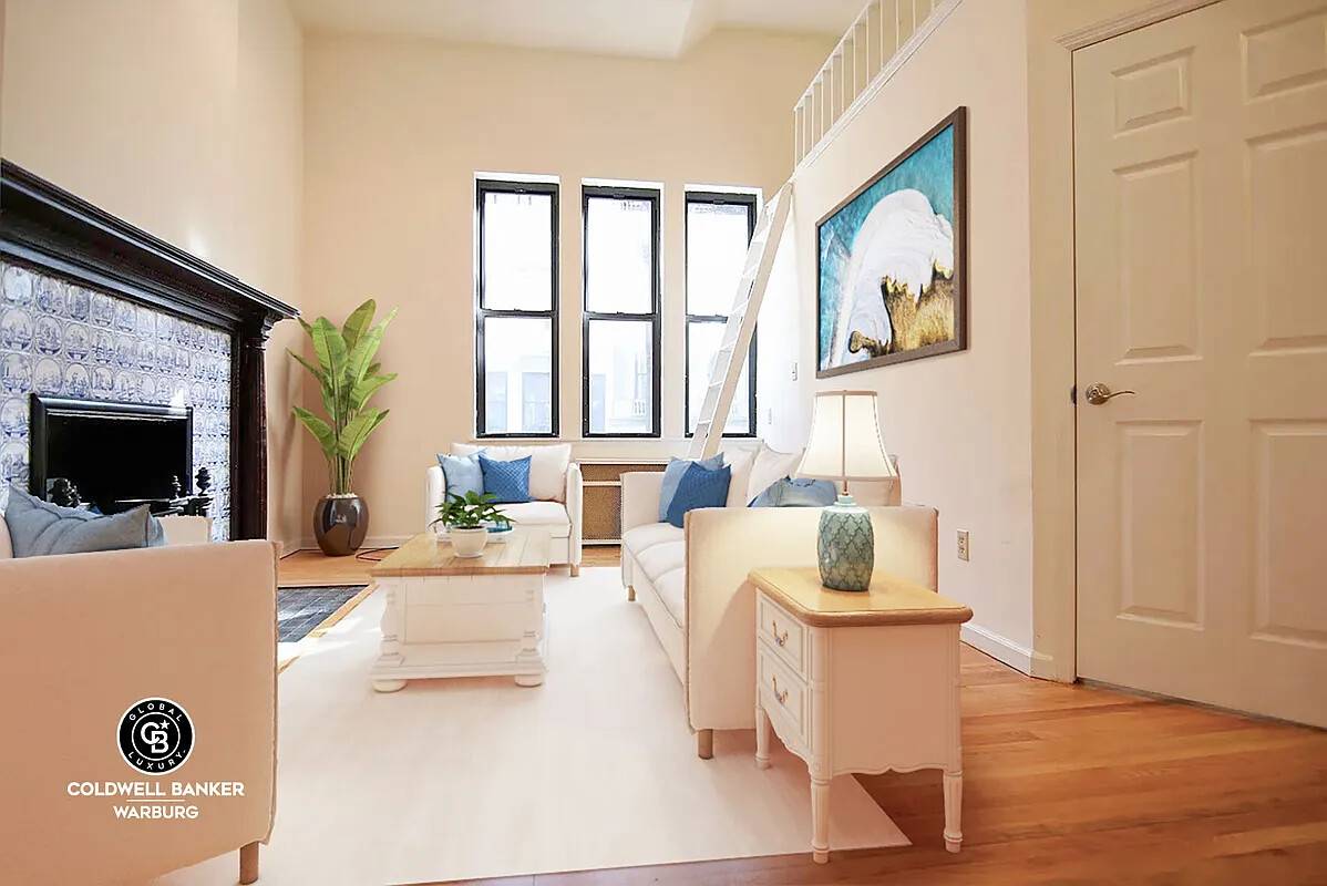 Magnificent 1BR home on parlor floor of lovely historic townhouse, South facing living room with mahogany fireplace w vintage porcelain blue tiles.