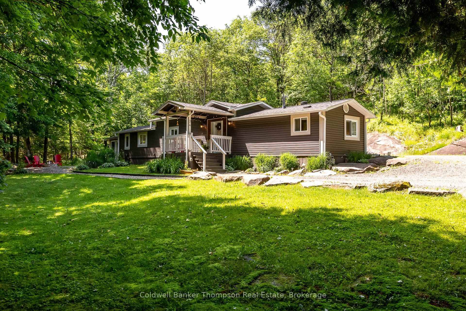 Set at the end of a quiet road, this modular bungalow offers peaceful year round living on a 1.