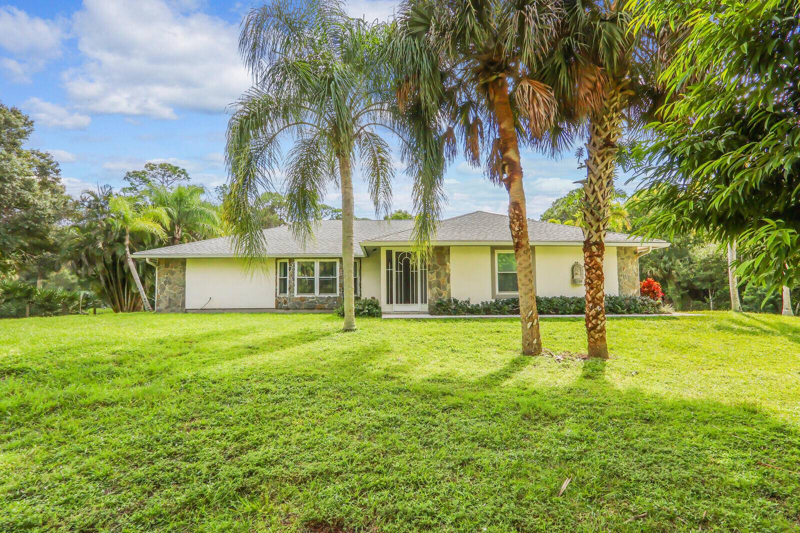 This well maintained home in Jupiter Farms offers 4 bedrooms, 3 bathrooms, a 2 car garage, and over 3, 100 total square feet, all situated on a fully fenced 1.