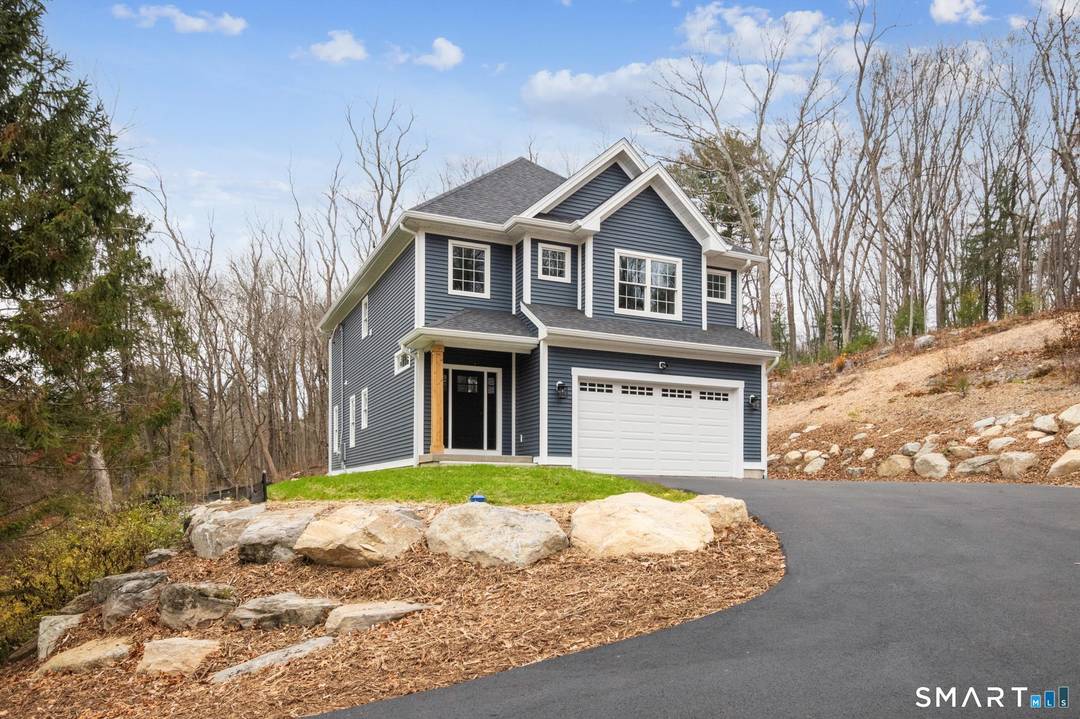 Step inside to discover a beautifully designed open concept living space featuring 9 foot ceilings, natural hardwood flooring, and custom handcrafted cabinetry throughout.