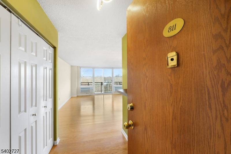 Showcasing sweeping river views from the 8th floor of The Mill, this updated residence offers elevated living with a bright, modern interior.