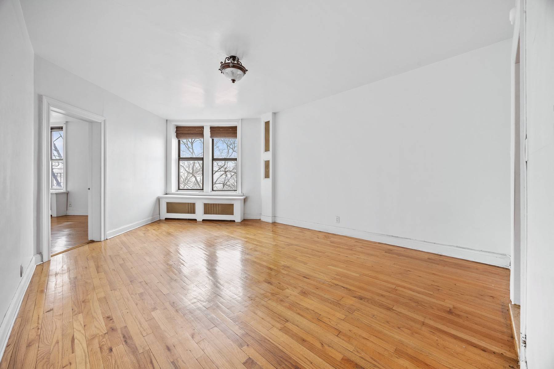 Experience the changing seasons from your sunlit one bedroom, one bathroom sanctuary, offering lush treetop vistas in summer and serene Hudson River views during fall and winter.