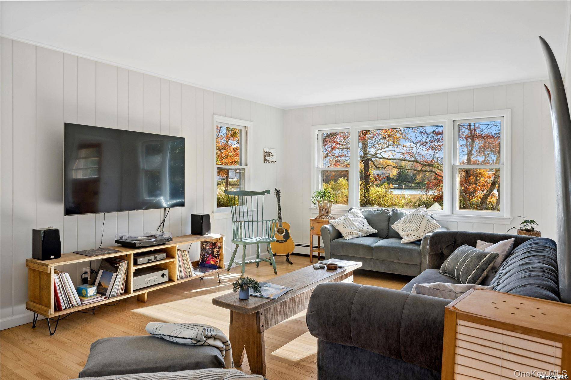 Enjoy Quintessential North Fork Living Year Round at this Chic Cape at Pipes Neck Cove.
