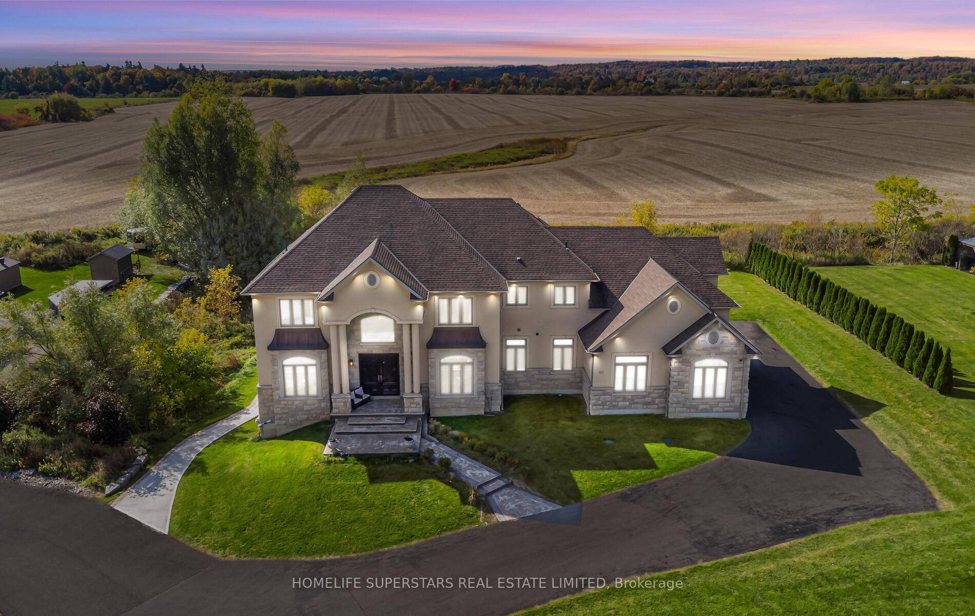 Welcome to this luxurious custom estate, offering an unparalleled blend of rural tranquility and urban convenience.