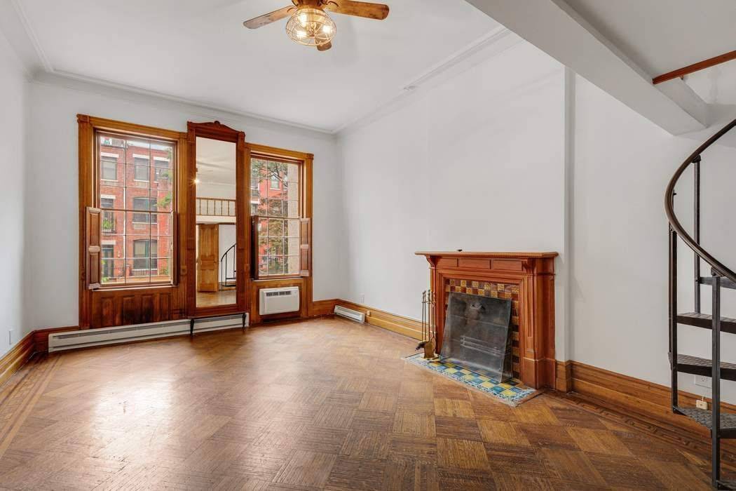 This turn of the century townhouse has been converted to four floor through residences, each retaining details reminiscent of the grandeur and style of 1890's New York.