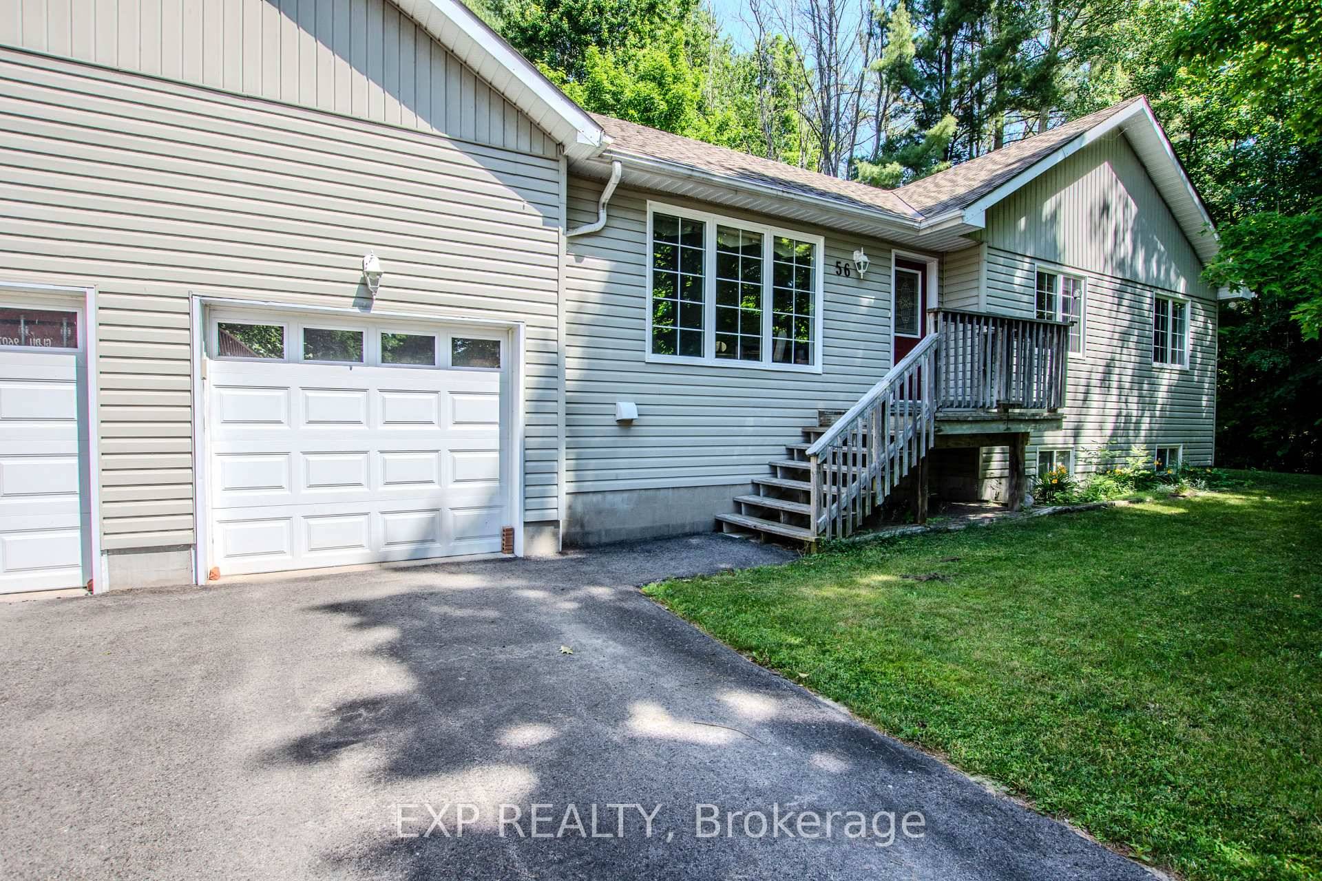Discover country serenity with city side convenience at 56 Becketts Sideroad a charming bungalow set on 6.