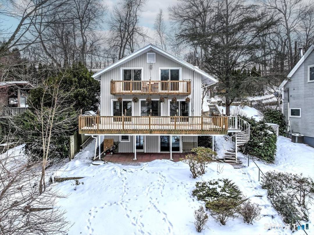 Nestled along the shore of sought after Candlewood Lake, this direct waterfront Contemporary home delivers the ultimate lake living experience !