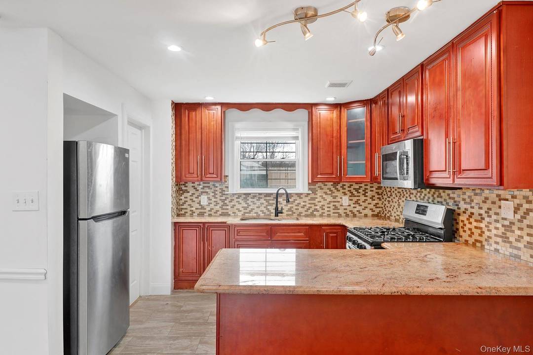 Just bring your things and live in this newly renovated, turnkey, move in ready single family tucked away on a beautiful, quiet, Cul De Sauc block of Jamaica.