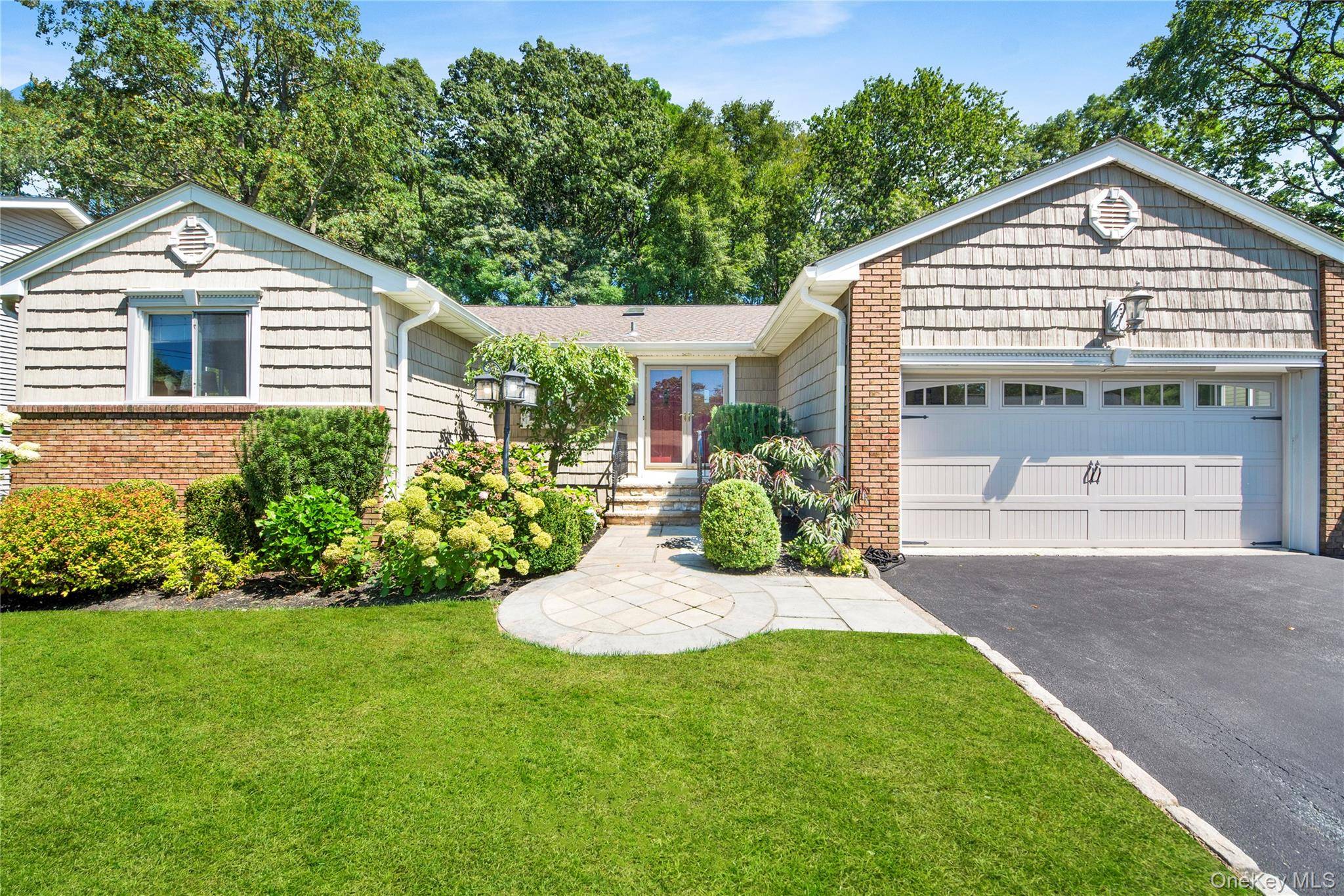 Nestled on a quiet cul de sac, this charming Ranch style home offers a perfect blend of comfort and style.