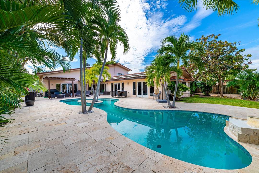 Impressive 5 bedroom home with loft and ocean access waterfront in prestigious Seven Isles an upscale security patrolled waterfront beach community and just minutes to the ocean !