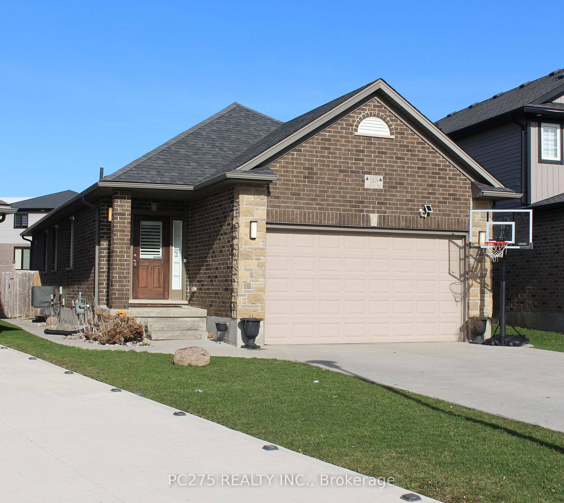 This beautifully maintained bungalow boasts a spacious open concept layout, featuring a large living room, dining area, and modern kitchen, all highlighted by elegant California shutters throughout.