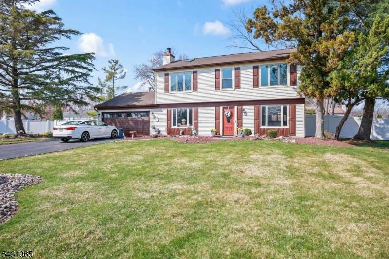 Welcome to this beautifully expanded 4 bedroom Colonial in the highly sought after Manalapan Green, where space, warmth, and everyday comfort come together effortlessly.