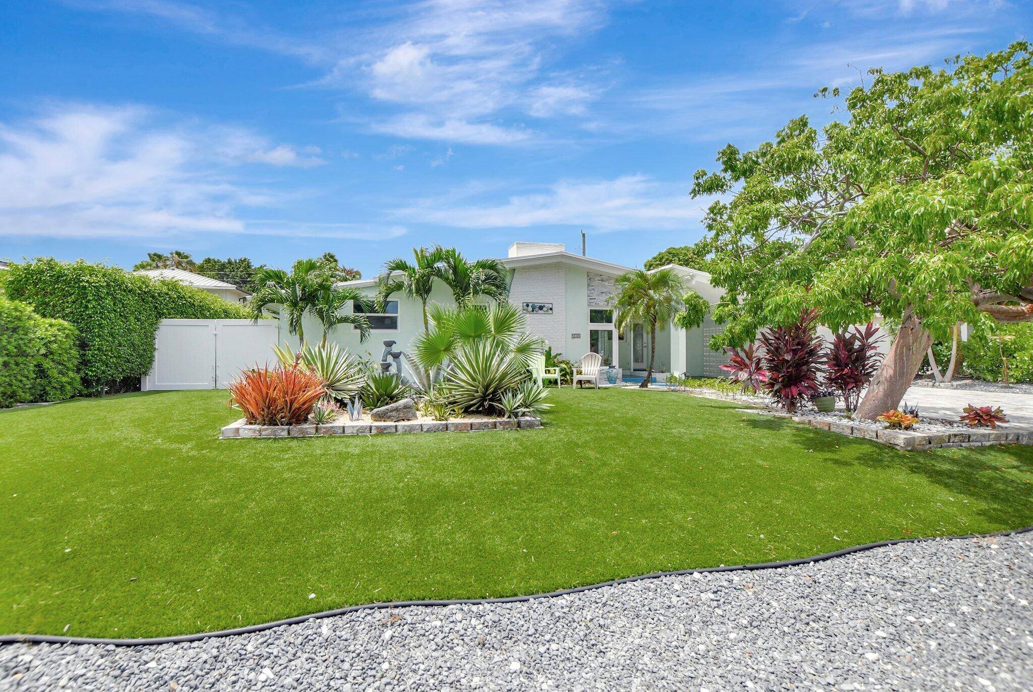 Welcome to your island inspired escape right in the heart of East Boca.