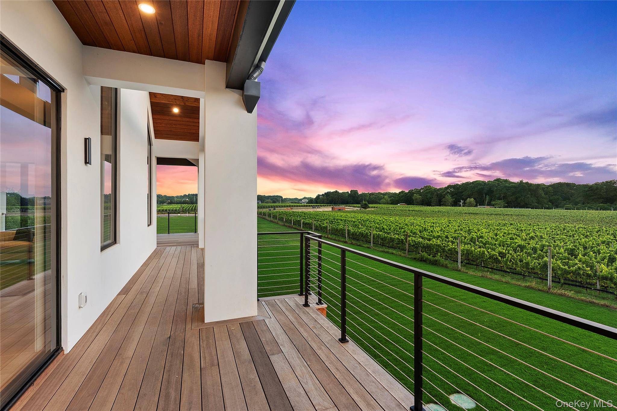 Experience the epitome of luxury living in this modern new construction estate, a truly unique offering on the East End framed by breathtaking vineyard views.