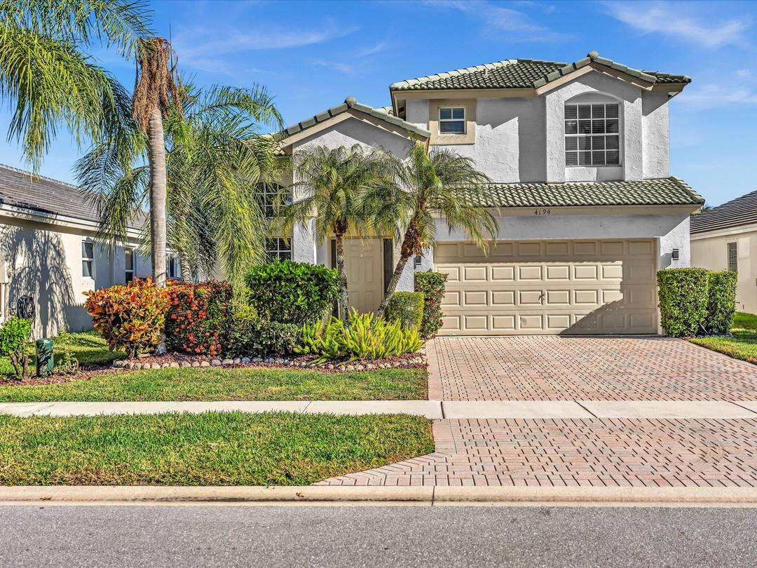 Beautifully upgraded and impeccably maintained home with tranquil private lake views in a sought after gated community, The Isles.