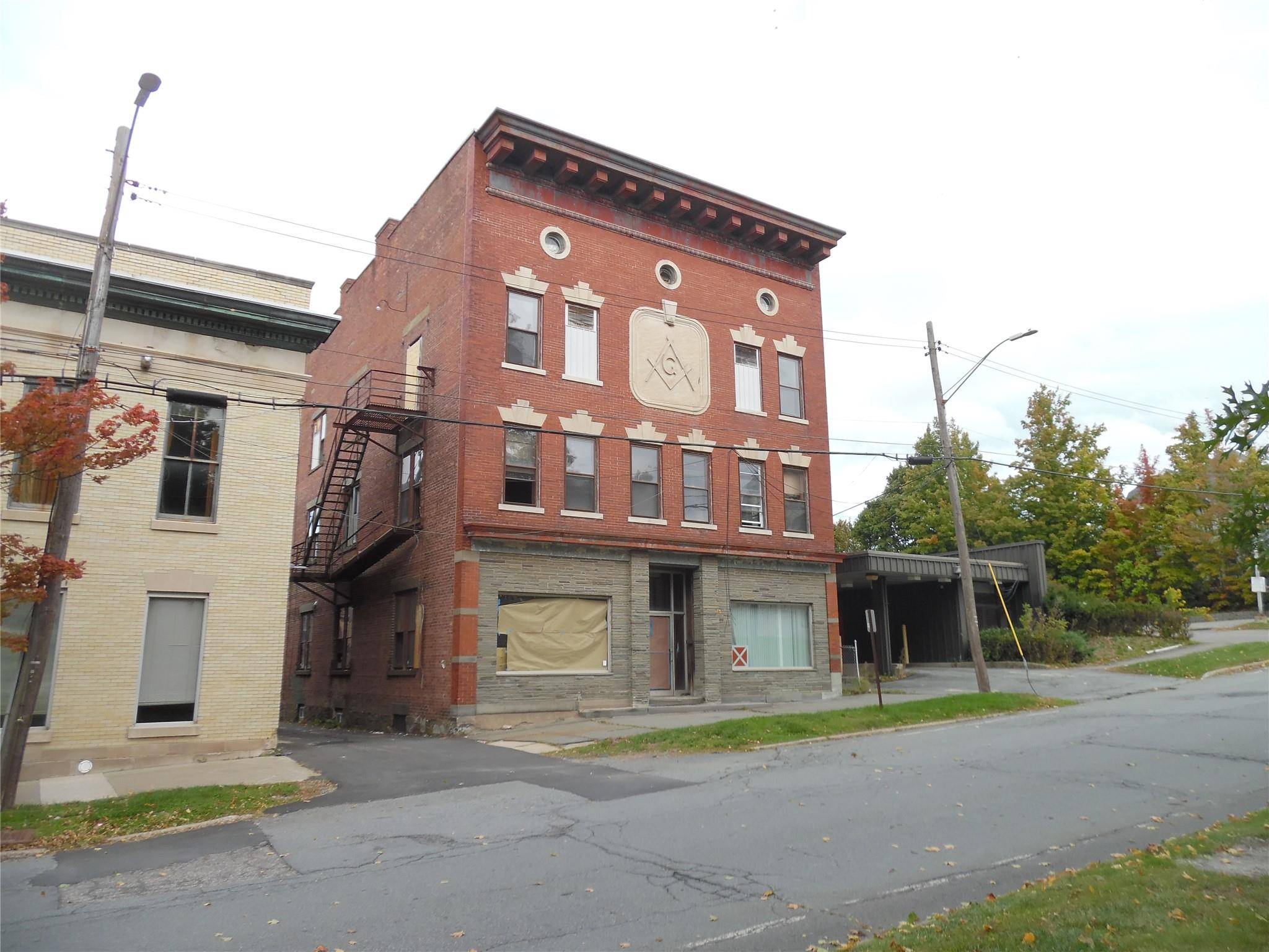 MOTIVATED SELLER ! This grand old brick building was once the home for the Monticello Masons and has always been referred to as the Masonic Building.