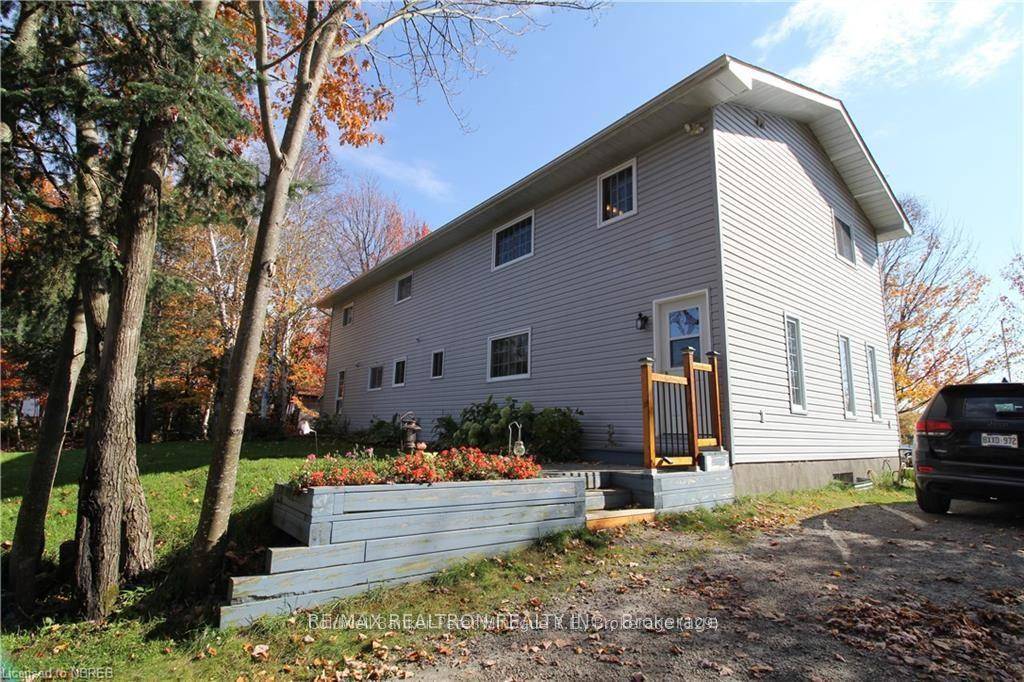 Exceptional waterfront home or cottage on beautiful McQuaby Lake.
