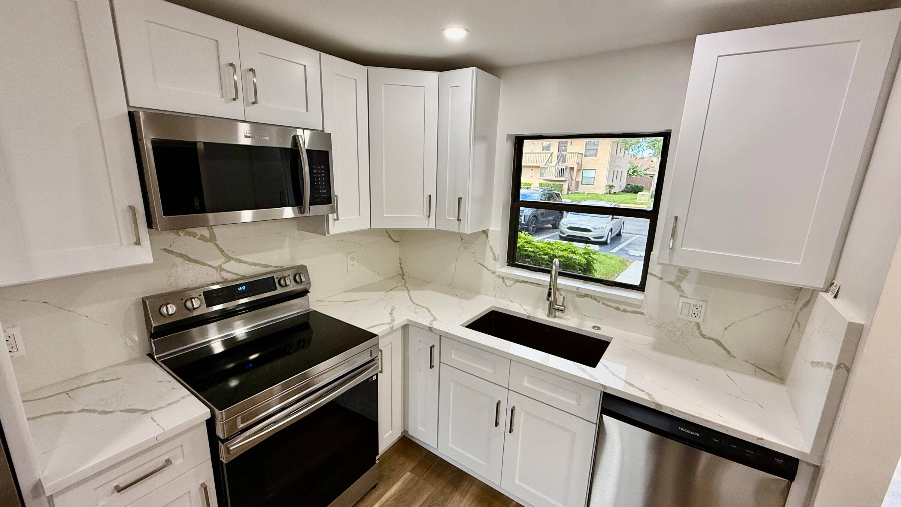 WOW ! ! Remodeled 2 bedrooms, 2 bathrooms 1st floor condo with lakeview and steps to the community pool.