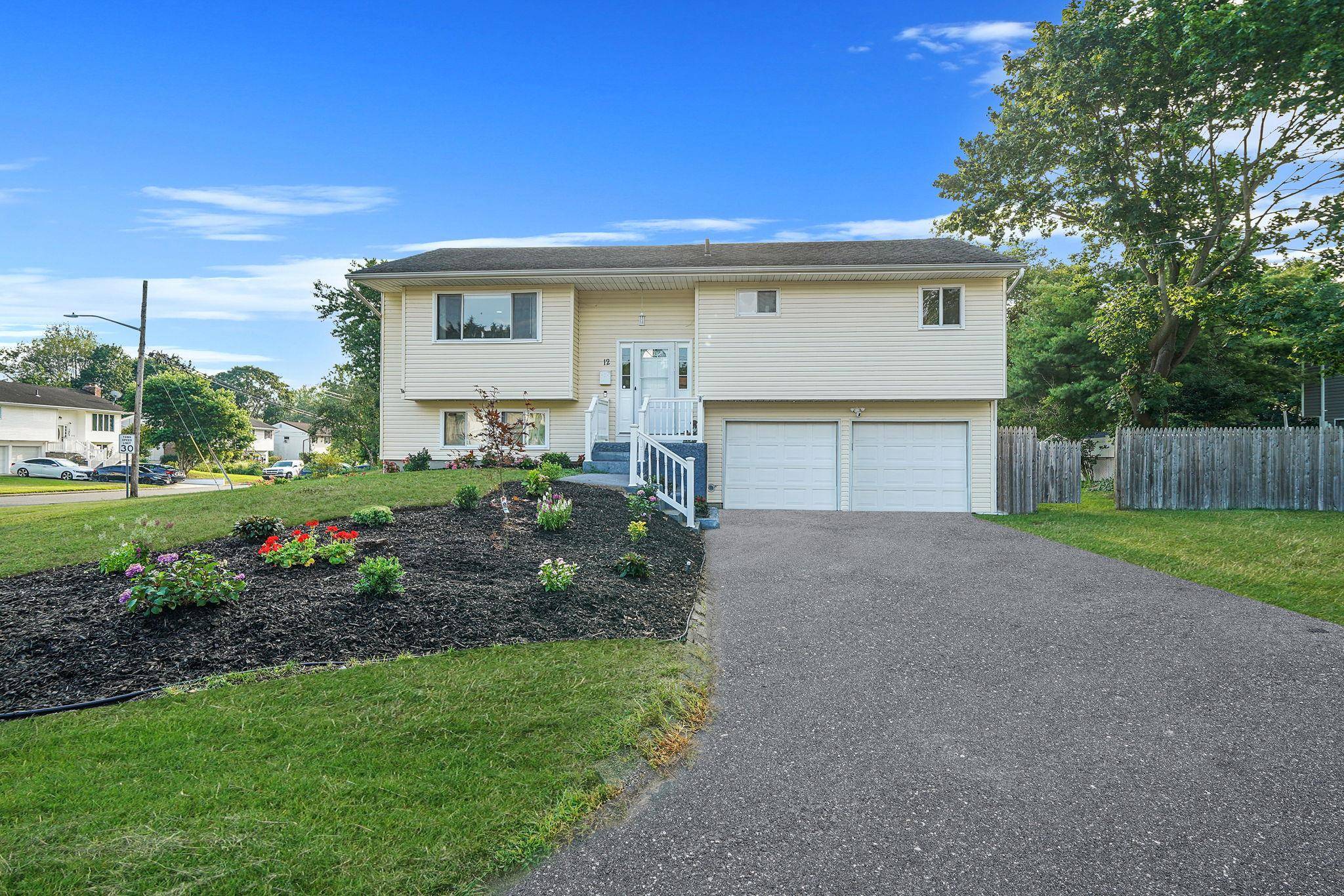 Welcome to 12 Circle Drive E nestled in the heart of East Patchogue.