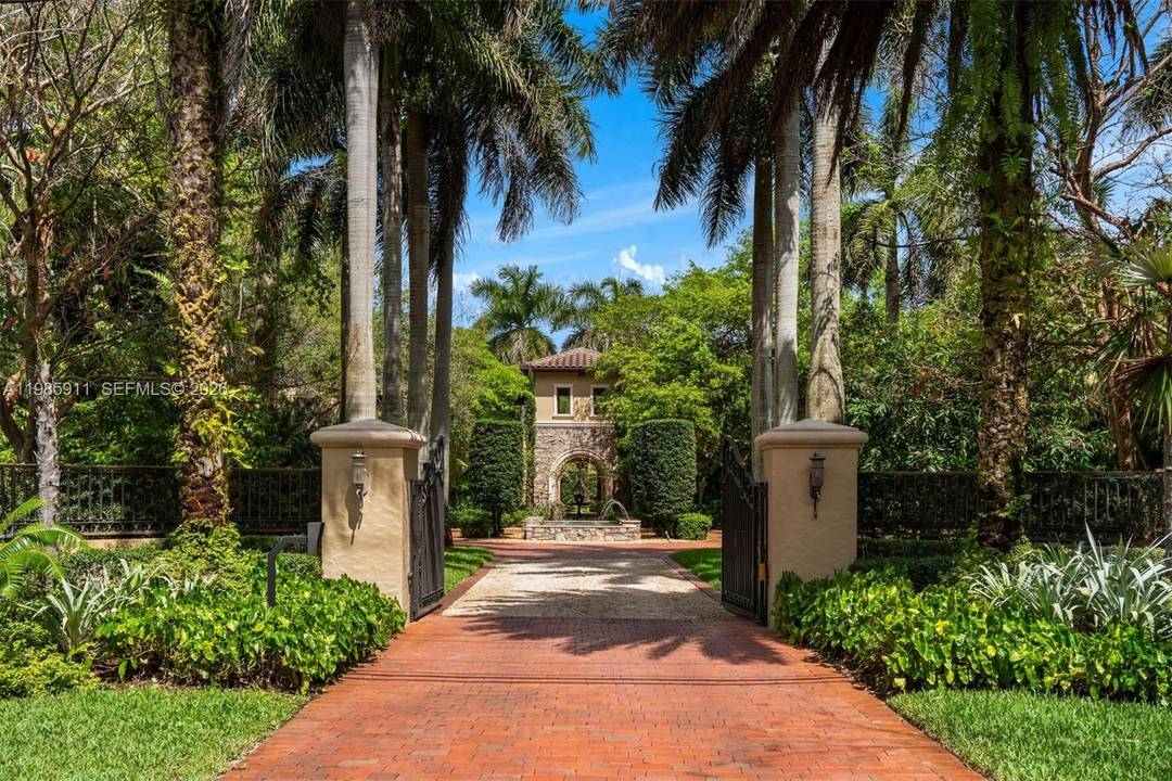 Set on a sprawling 1. 12 acre lot in the heart of Pinecrest, this extraordinary grand Tuscan inspired estate offers 6, 624 SF under air and 9, 771 total SF ...