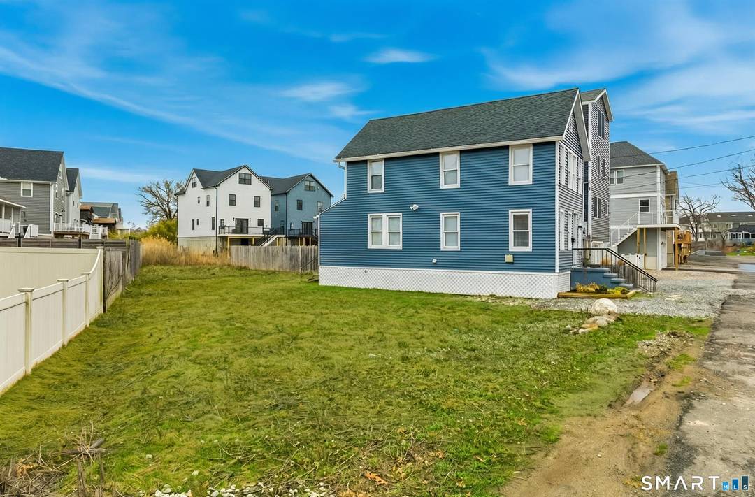 Wake up to coastal breezes and water views in this charming beachside Colonial, perfectly positioned just 87 steps to the sand.