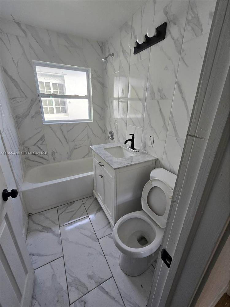 This meticulously renovated duplex offers a rare buy and hold or live on one side opportunity in the high growth 33407 ZIP code.