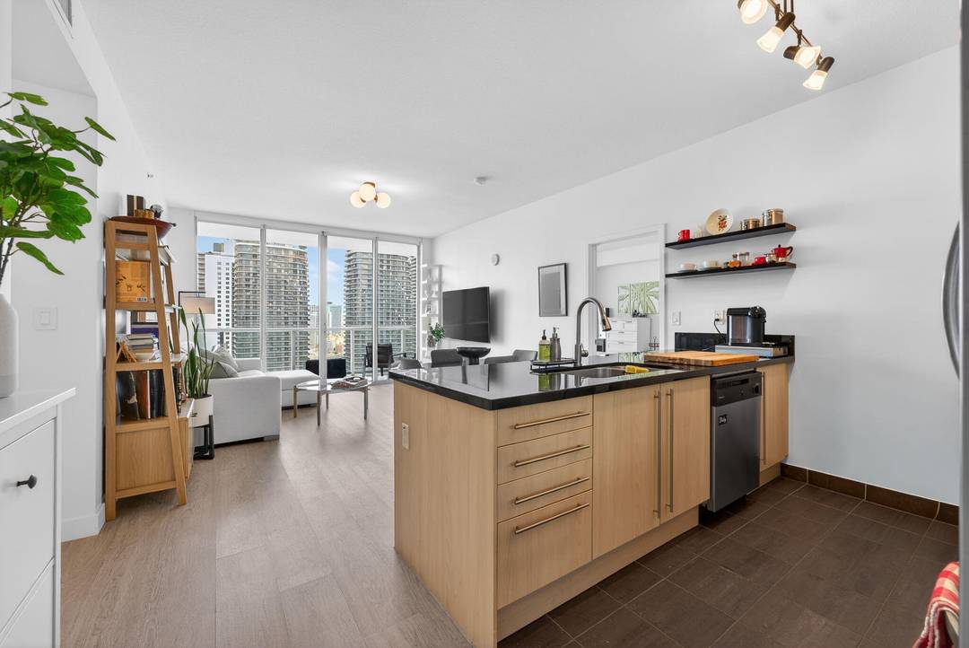 Experience elevated city living in this stunning penthouse residence at Axis on Brickell, ideally located at 1111 SW 1st Ave in the vibrant Brickell Financial District.