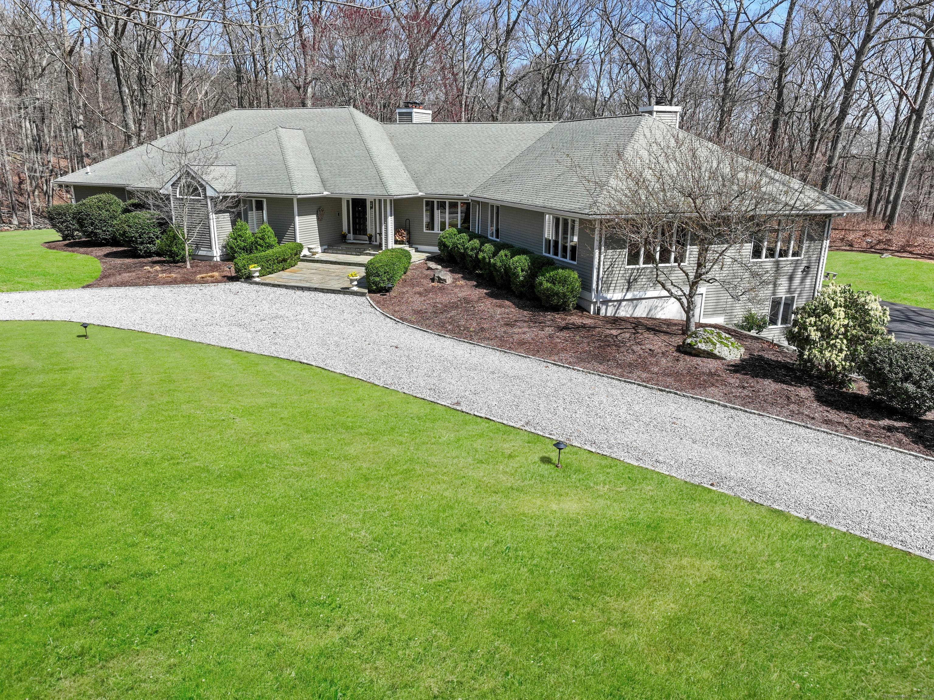 Just 60 miles east of New York City, on a quiet scenic country road in lower Easton's coveted Aspetuck Four Corners, nestled on 3 acres, is what appears to be ...