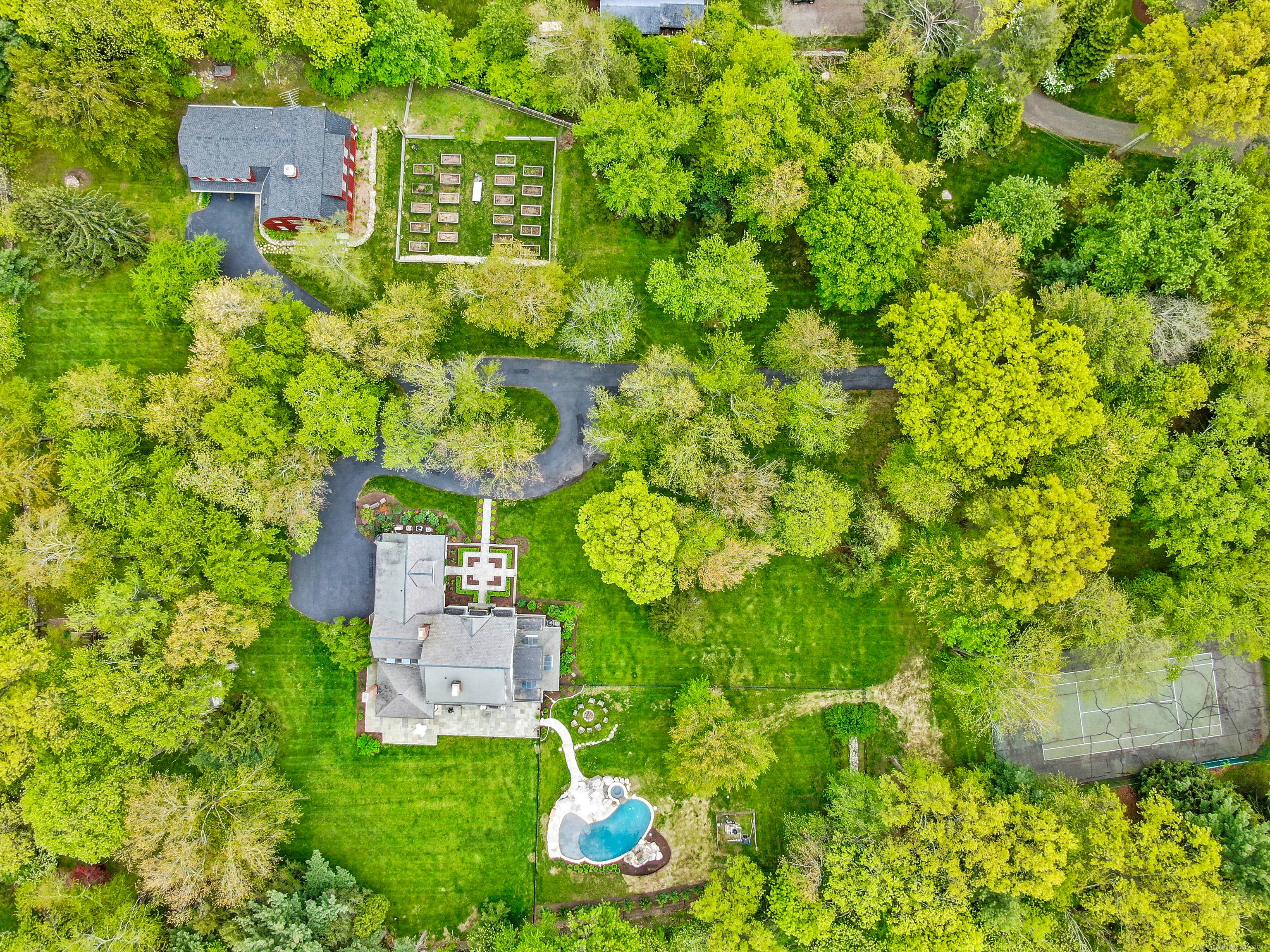 Discover your private sanctuary at the end of a serene cul de sac in Greenfield Hill.