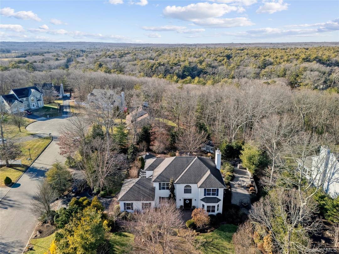 Welcome to 7 Brittany Court, a spacious and beautifully maintained 2700 SF home tucked away in a quiet cul de sac of The Meadows !