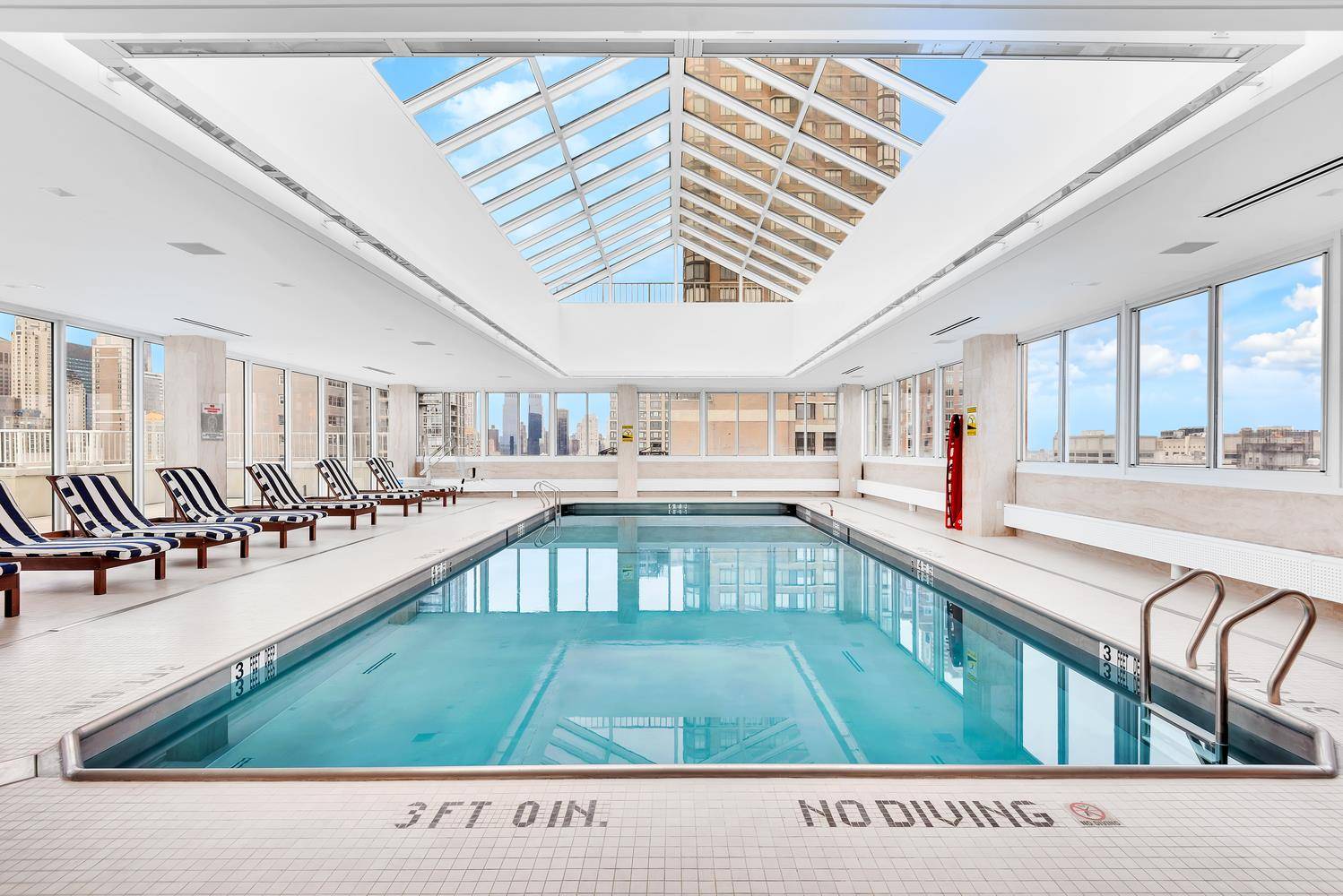 Welcome to the luxurious Concorde Condominium, where opulence meets panoramic views of the New York City skyline.