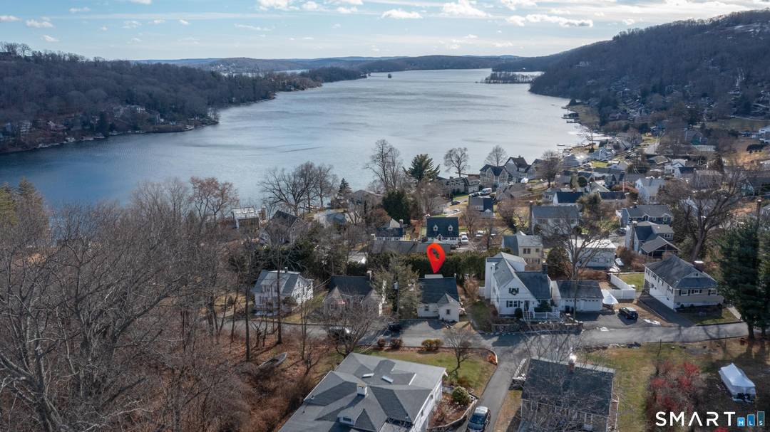 Beautifully updated and charming home in the coveted Candlewood Knolls community on Candlewood Lake.