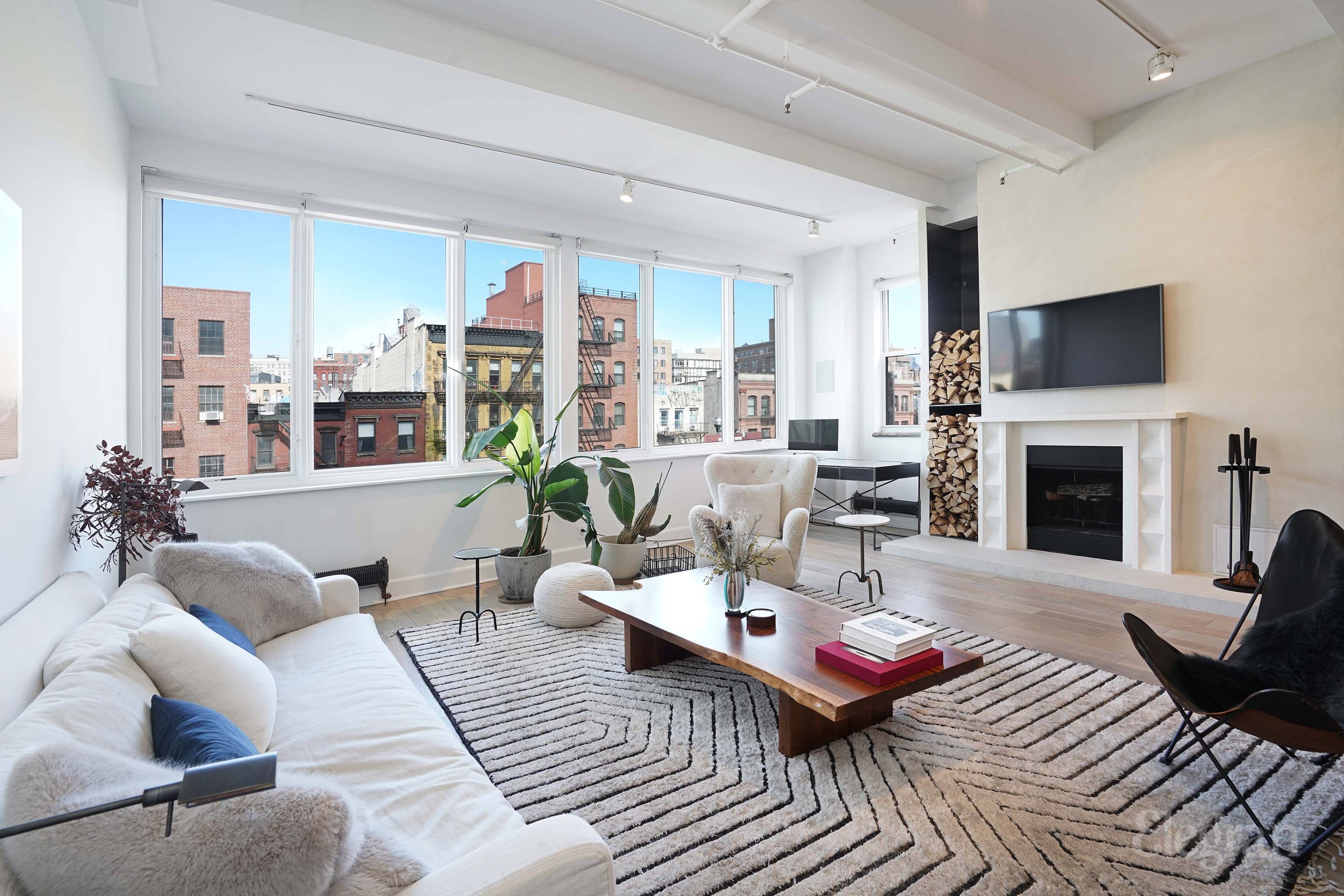 Featured in Elle Decor magazine for its seamless concrete bathrooms and fireplaces, this Nolita apartment was overhauled in 2018 for a stunning minimalist and comfortable ambiance.