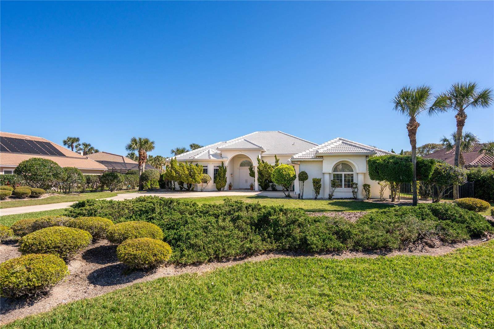 Nestled in the prestigious gated community of Island Estates, this waterfront 3 bedroom office, 3 bathroom home sits on a 2.