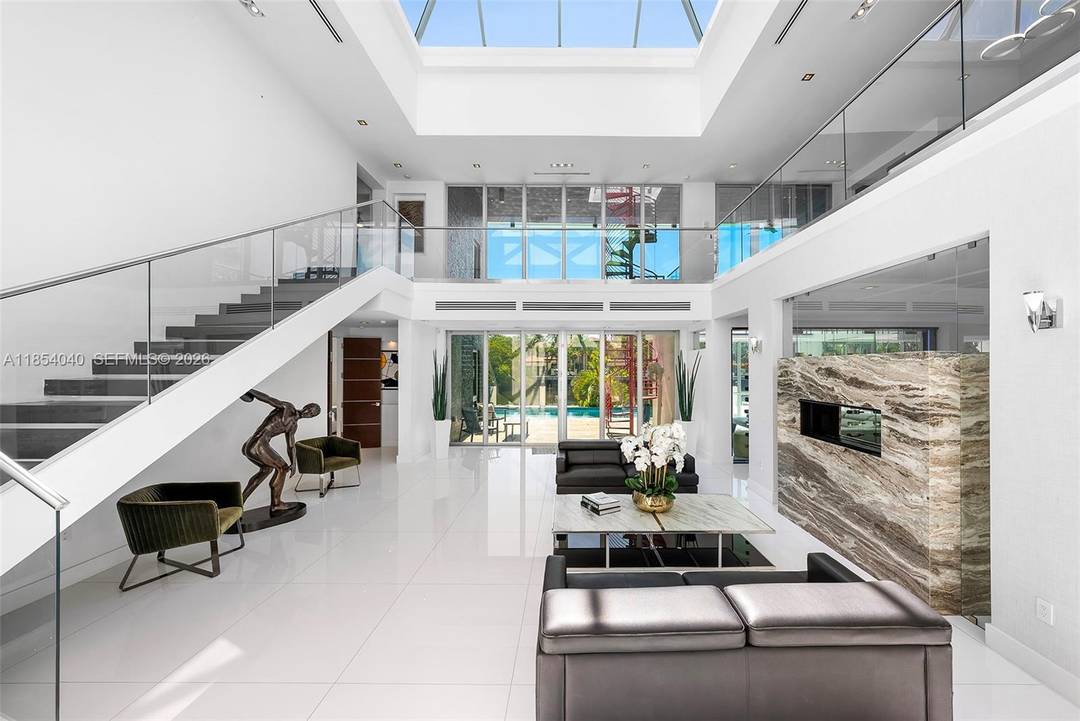 Discover luxury in this custom modern home on a premier Las Olas Isles street.