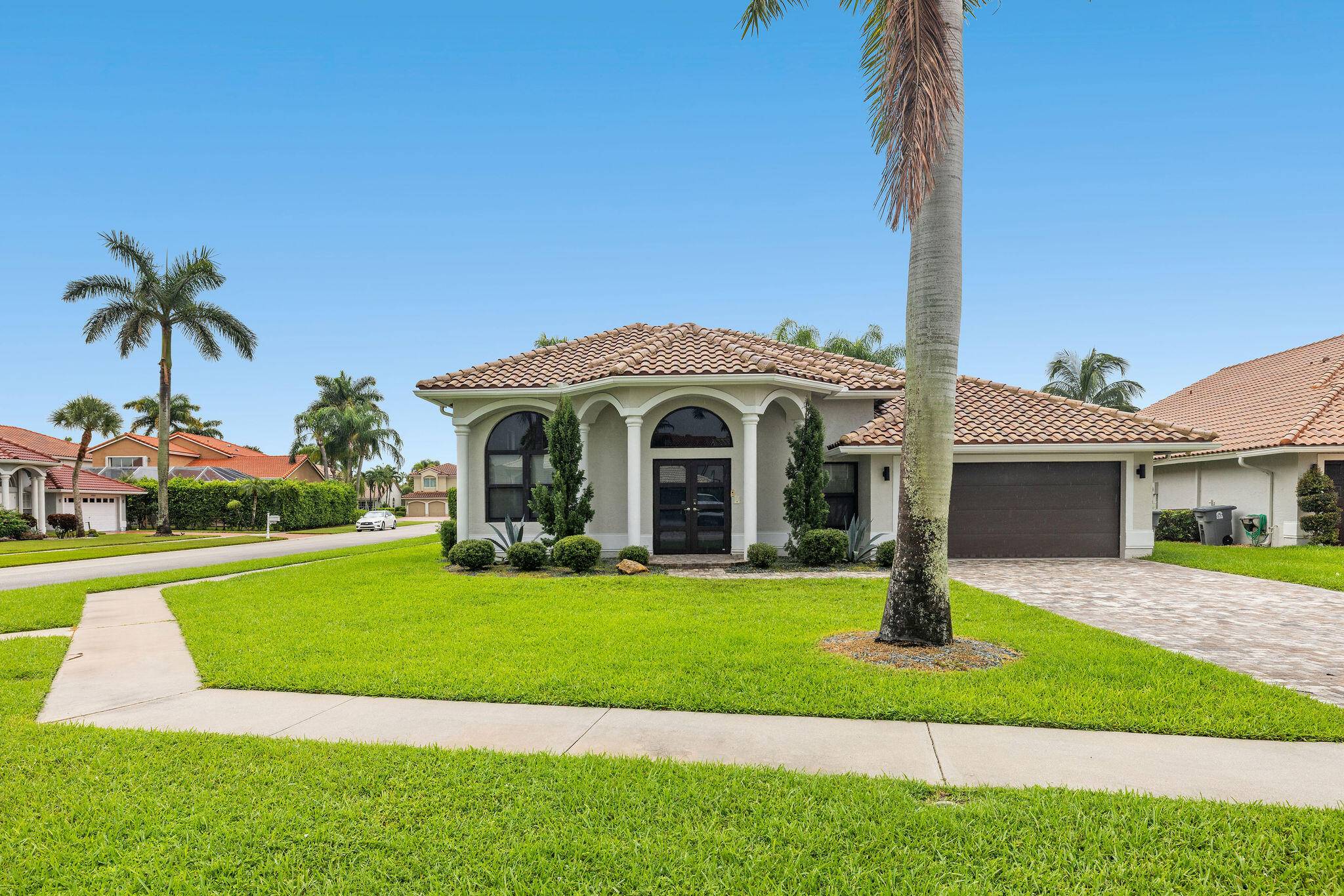 PRICED TO SELL ! Exceptional 4br, 2ba single story modern home on cul de sac in Boca Isles.