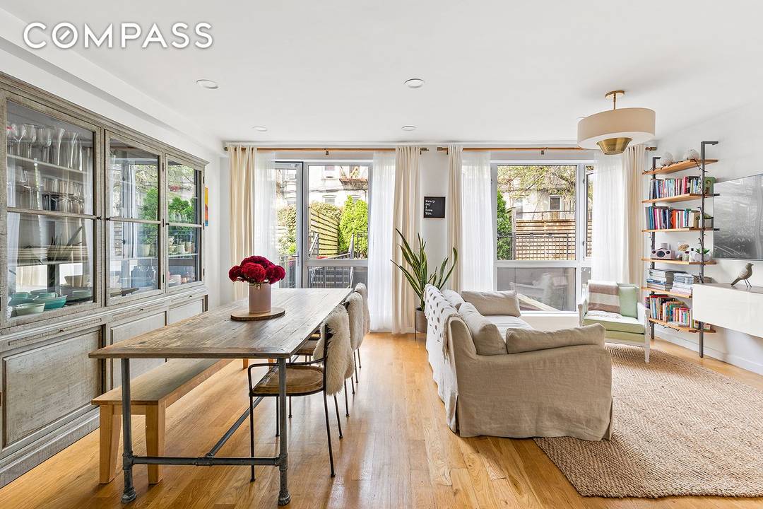 Welcome to 305 Cooper Street, Unit 1B a brilliantly reimagined duplex offering nearly 1, 900 square feet of refined indoor and outdoor living.