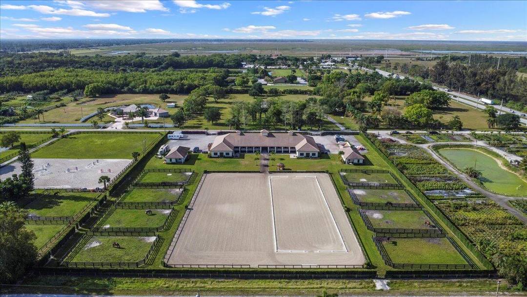 Located just a short drive to Wellington's horse showgrounds, this luxurious barn, built in 2017, is in impeccable condition.